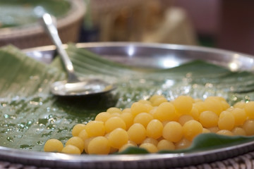 Sweety Gloden Drop on banana leaf, Traditional thailand dessert, selective and soft focus.