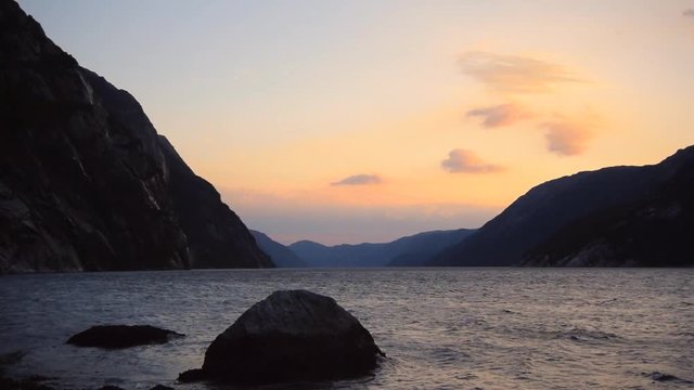 Waves in the Lysefjord Fjord in Norway during a summer sunset