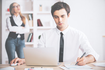 Young businessman working on project