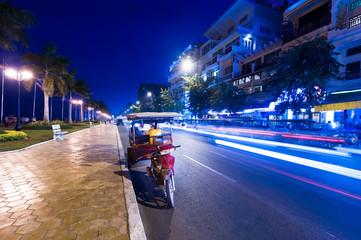 Moto taxi at evening asian city. Scene of night life at most popular tourist street near Mekong...