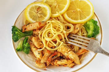 Lunch with pasta, chicken, lemon, Brussels sprouts