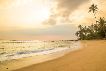 Beautiful sunset at tropical beach in Sri Lanka