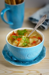 Soup in a blue ceramic bowl