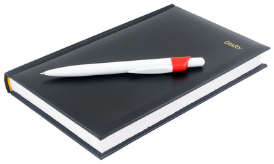 Black diary and white pen