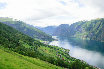 Naklejka na ściany i meble landscape view from the heights along the steep rocky fjord