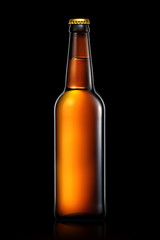 Beer bottle or cider isolated on black background