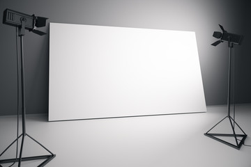Blank white billboard with professional lighting