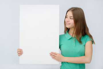 Woman showing copy space for product or text on open hand palm, smiling joyful and happy.