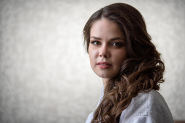 Naklejka premium Portrait of a beautiful young healthy woman in a robe