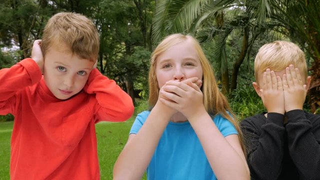 Three children play see no evil, hear no evil, speak no evil
