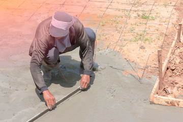 The construction of concrete road in the morning.