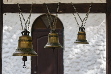 Church bells at an entrance to a chapel