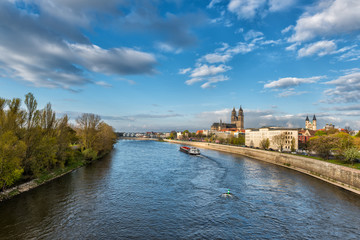 Fototapeta premium Magdeburg - wide view on the cathedral and river Elbe, beautiful landscape with blue sky and clouds, Saxony, Germany