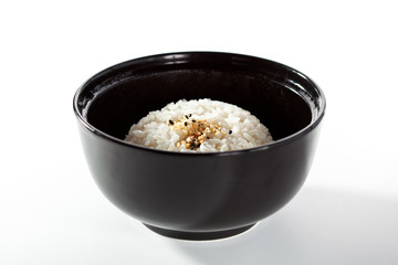 Black Bowl of Cooked Rice over White