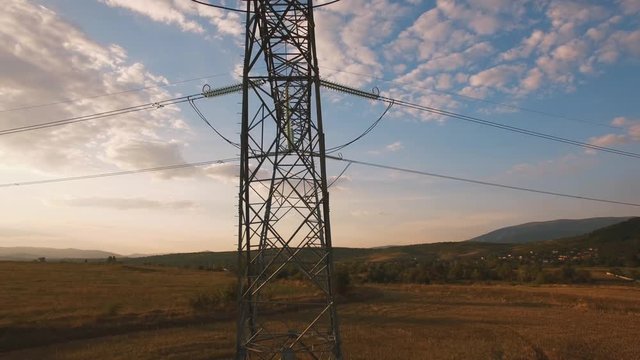 Electricity pylons at sunset / Aerial videos