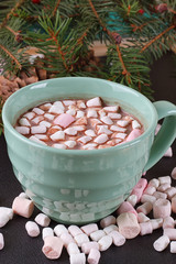 mug with hot chocolate and burning lantern