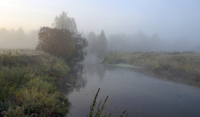 Autumn landscape.Small forest river Torgosha in Moscow region,Russia.