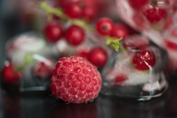 Frozen berries on wooden table