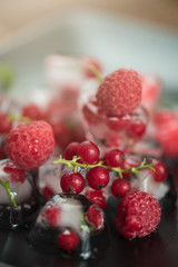 Frozen berries on wooden table