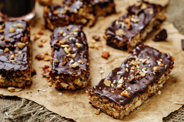 Coconut Granola Bars with chocolate glaze and nuts
