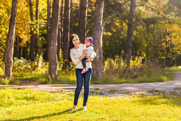 Mother and daughter in the autumn park