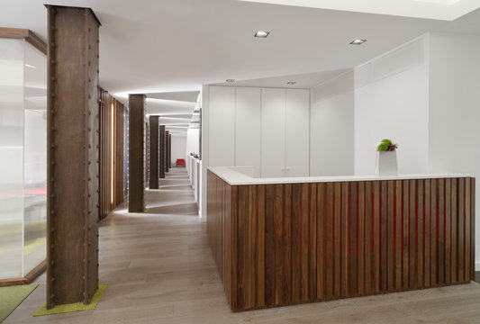 Wood panelling and steel column in office space