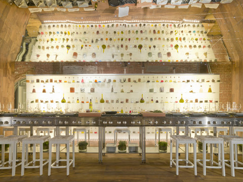 Empty bar with colourful bottles on wall