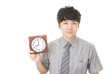 時計を持つ笑顔のビジネスマン