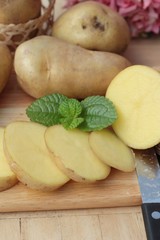 Potatoes raw vegetables with slices for cooking.