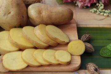 Potatoes raw vegetables with slices for cooking.