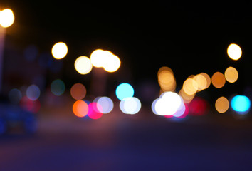 Vintage toned blurred street and car lights, urban abstract night time background.