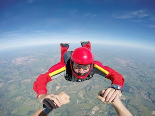 Skydiving senior man holding hands © Mauricio G
