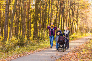 Happy family having fun outdoors in autumn park