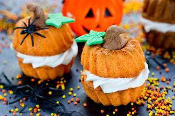 Funny Halloween cupcakes shaped pumpkin with cream