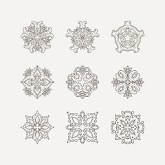 Set of ornate vector mandala symbols. Mehndi lace tattoo. Oriental weave.
