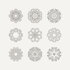 Set of ornate vector mandala symbols. Mehndi lace tattoo. Oriental weave.