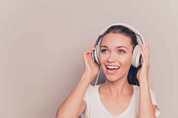 Portrait of happy music lover listening music and singing