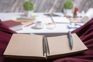 Blank brown notepad on lap