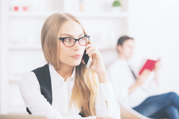 Gorgeous blonde girl talking on phone