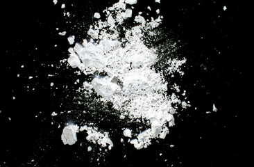 White powder on a black background abstraction