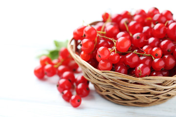 Red currant on a white wooden table