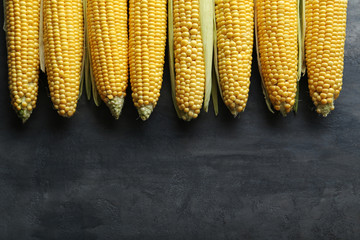 Sweet corns on a grey wooden table