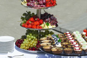 Papier Peint photo Buffet, Bar Catering service . sandwiches meat, fish, vegetable canapes on a festive wedding table outdoor