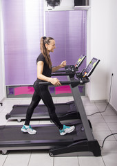  A young woman exercises in a gym