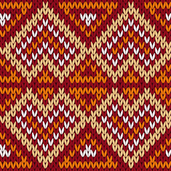 Ethnic knitting seamless pattern in warm hues
