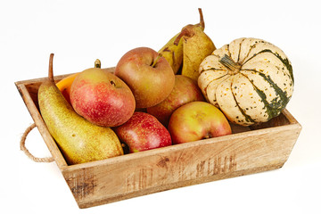 Isolated basket full of autumn fruits