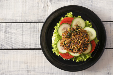 Delicious vegan burger on wooden table rustic and healthy food