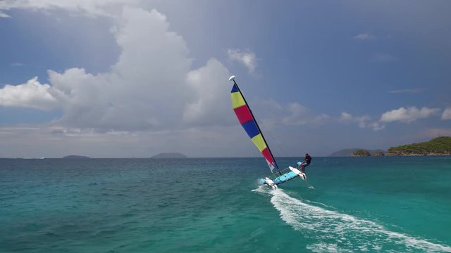 Young man flying a catamaran at Cinnamon Bay Beach, St John, United States Virgin Islands