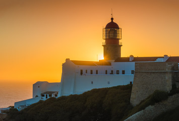Sunset and a view of the lighthouse at Cape St. Vincent. Portugal. Region Algarve