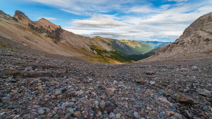 Rocky slopes in the mountains. Amazing view at the peaks which rose against the cloud sky. Glacier basin trail Mount Rainier National Park